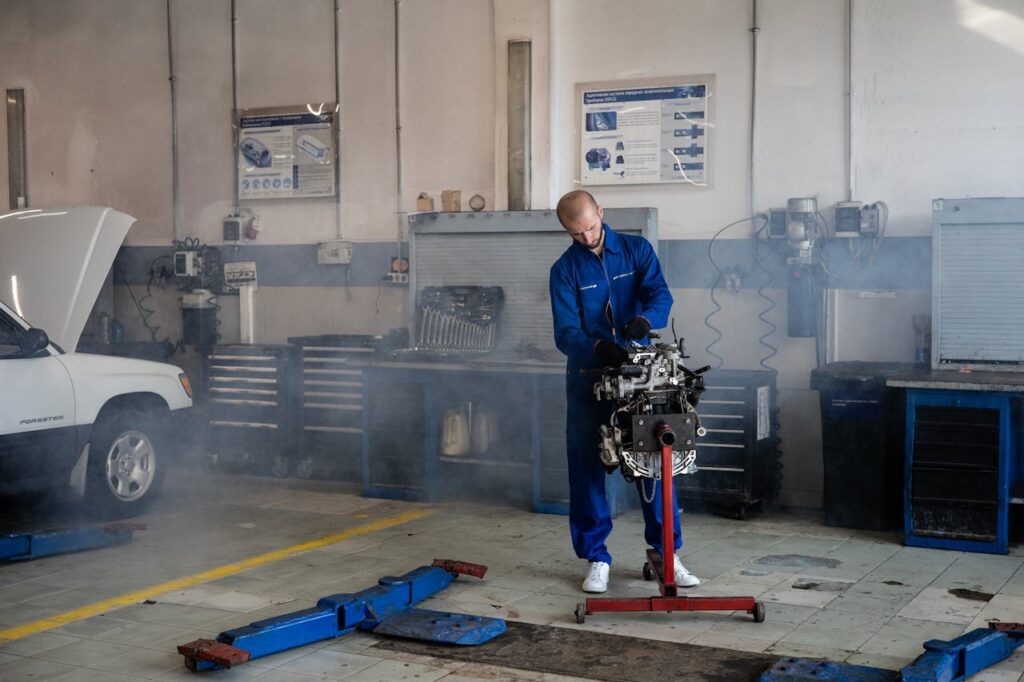 A Mechanic Working on a Car Engine